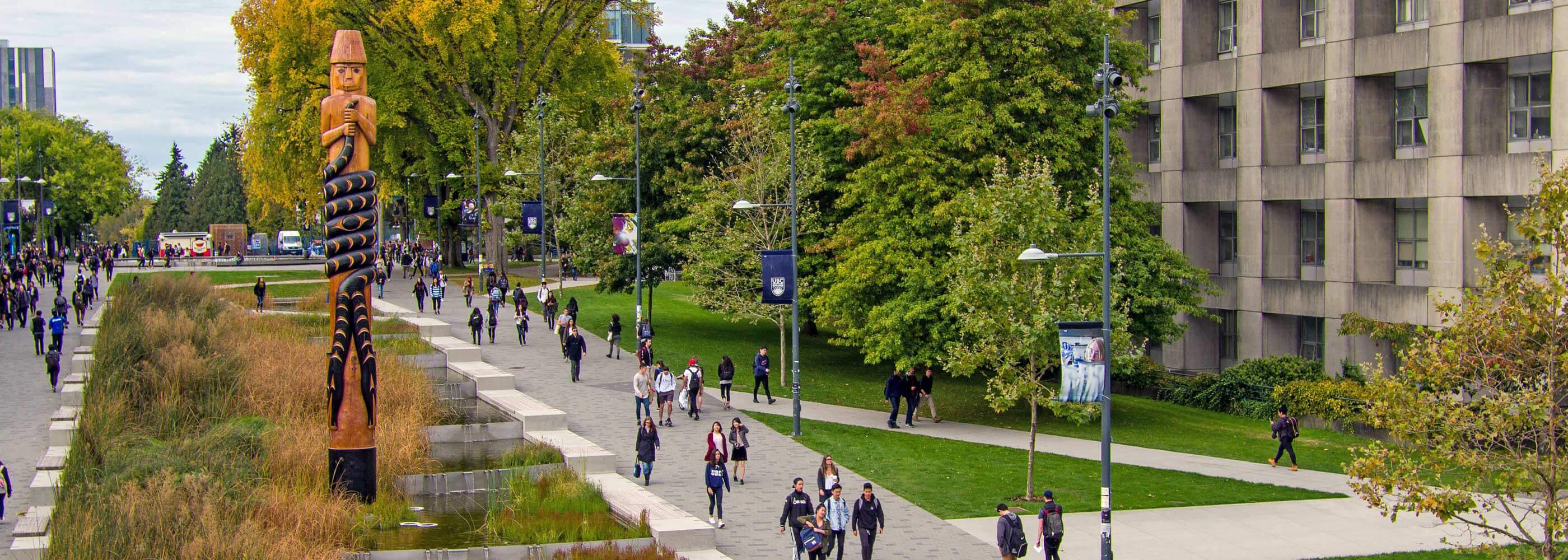 Groups of people tour the UBC Vancouver campus to see architecture, art and nature.